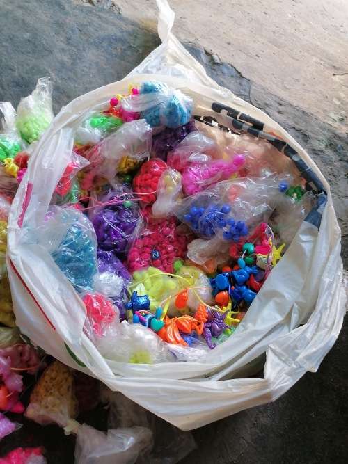 Bag full of children beads for making necklaces ect