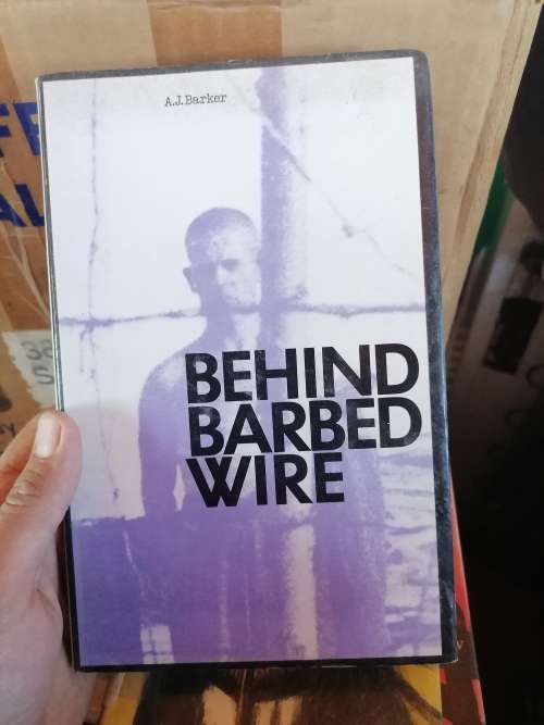 Behind Barbed Wire - A. J. Barker