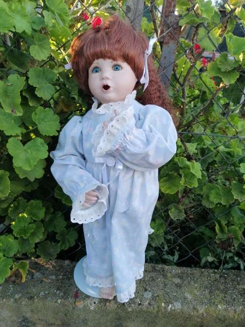 Cute porcelain doll with chip on lip. Some makeup would sort that
