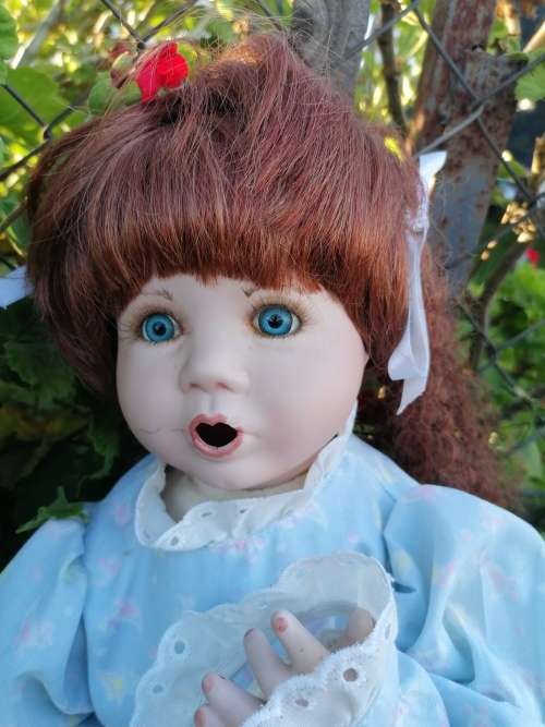 Cute porcelain doll with chip on lip. Some makeup would sort that