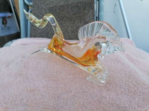 2 murano glass horses. Small one Missing a leg large one small chip on edge of tail