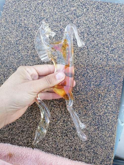 2 murano glass horses. Small one Missing a leg large one small chip on edge of tail