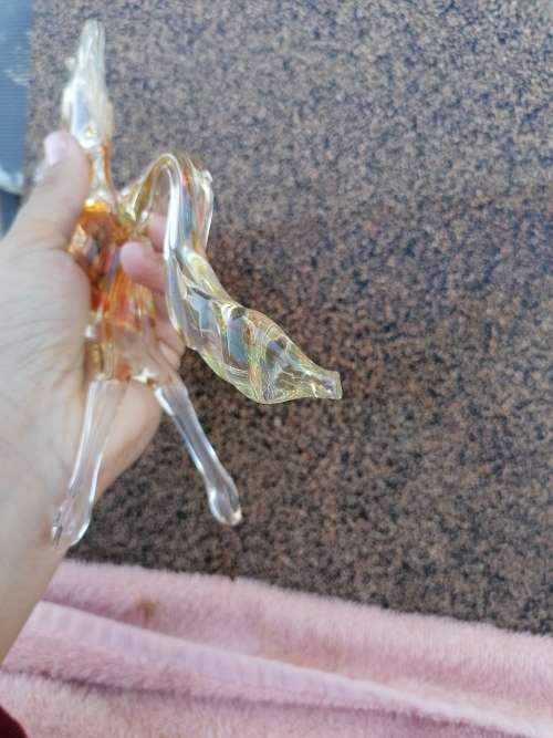 2 murano glass horses. Small one Missing a leg large one small chip on edge of tail