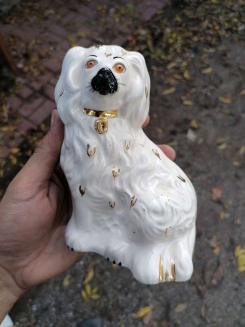 Royal Doulton dog porcelain figure. Have been repaired