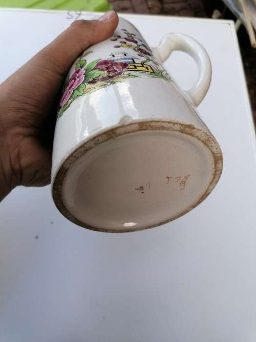 Antique porcelain pitcher. Have some chips