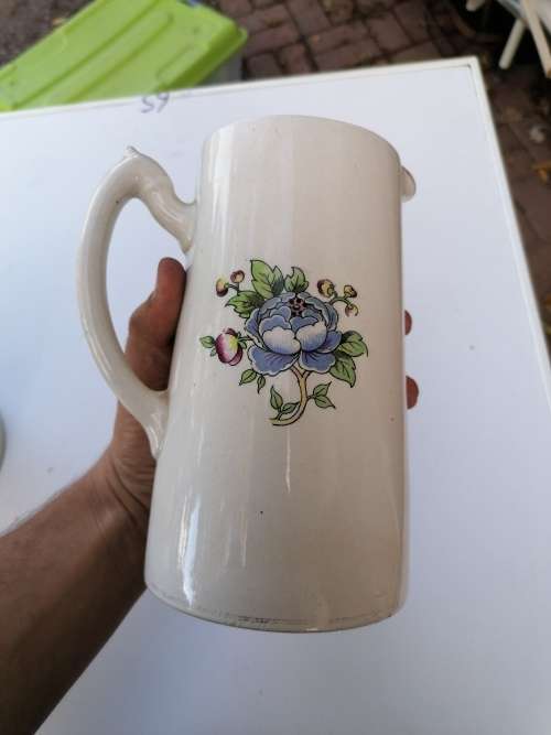 Antique porcelain pitcher. Have some chips