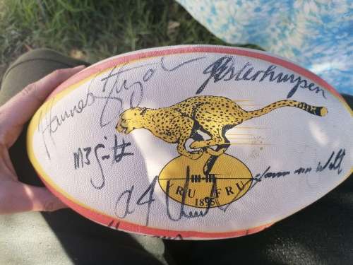 Two signed cheetah rugby balls