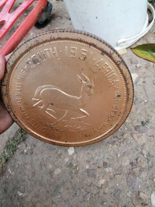 Awesome Rare 1961 tin in the shape of a coin