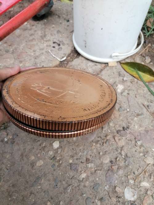Awesome Rare 1961 tin in the shape of a coin
