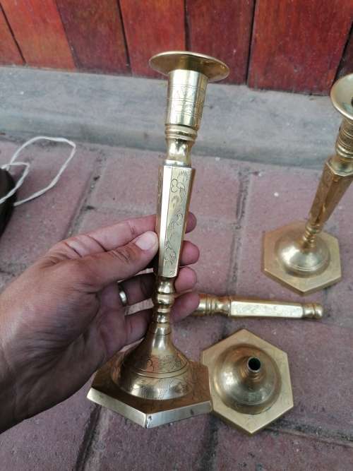 Vintage brass candle holders. One need repair