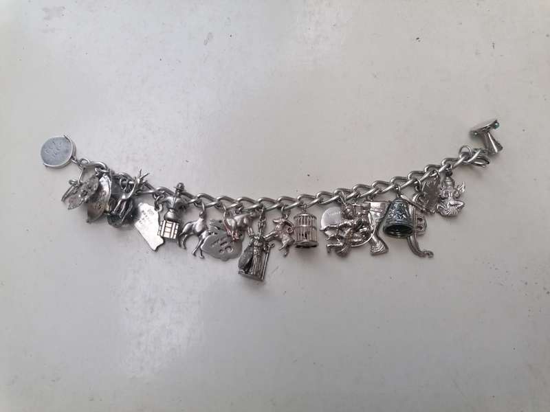 Wow stunning silver charms bracelet with 23 silver charms