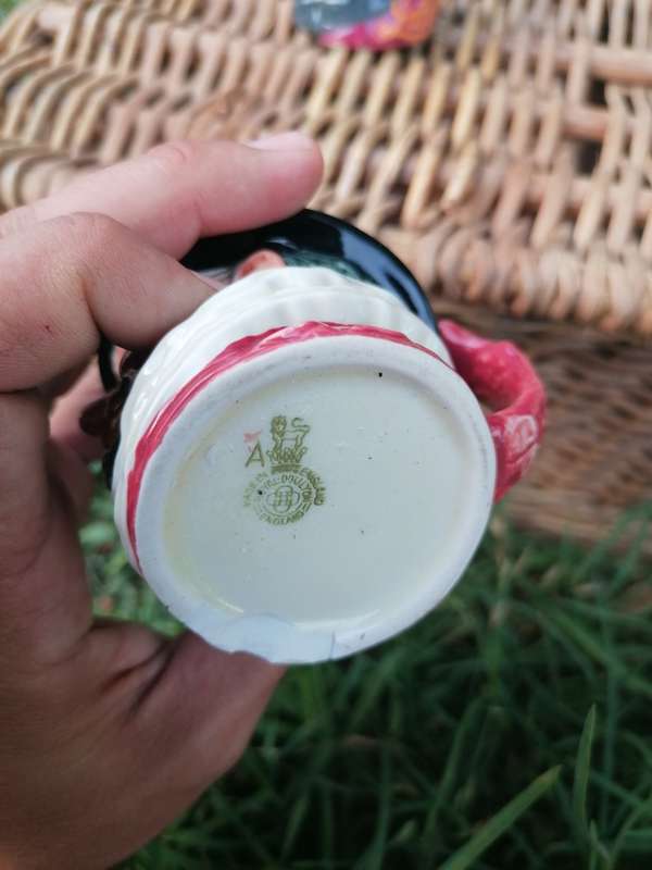 Royal Doulton Beefeater Toby Mug chipped at the base.