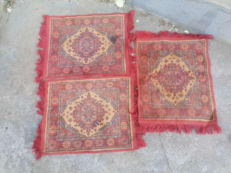 Small machine made carpets. Needs a good cleaning