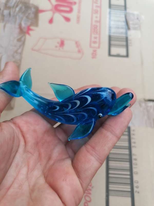 Glass art dolphin. Small chip on top fin