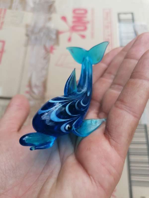 Glass art dolphin. Small chip on top fin