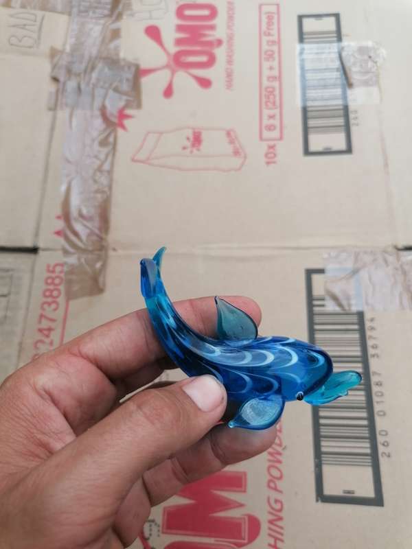 Glass art dolphin. Small chip on top fin