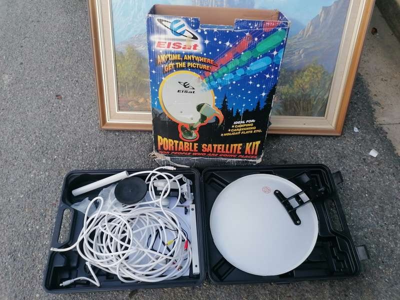 Potable satellite dish still with original packaging