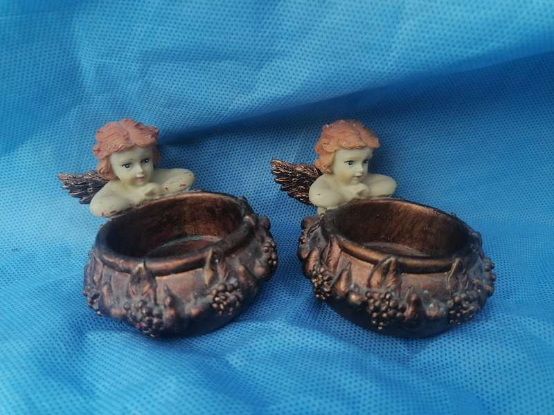 Pair of angel candle holders