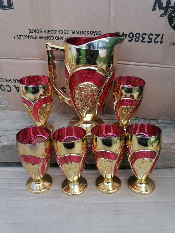 Stunning glassware set. One cup have a chip on the bottom other than that in good condition.