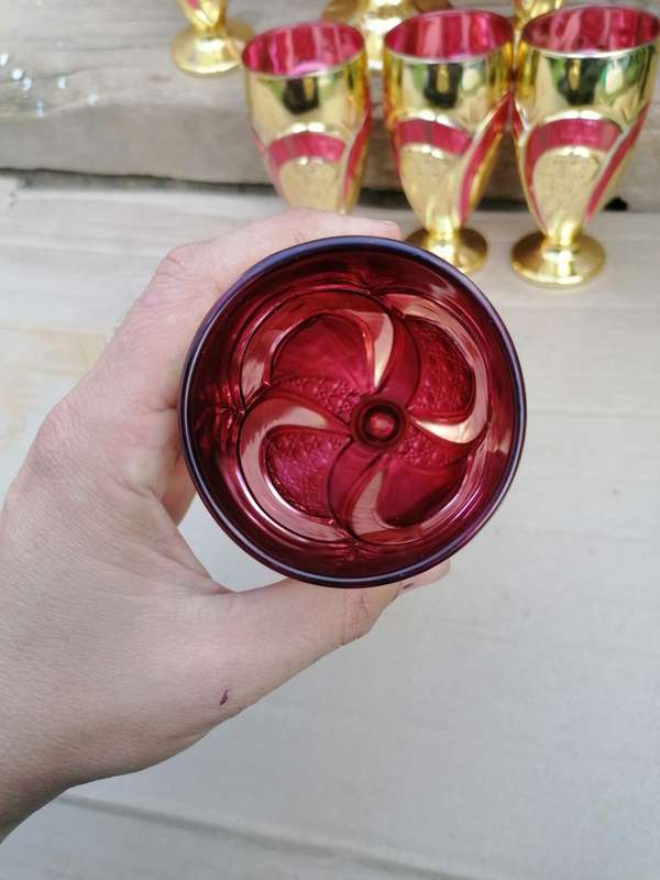 Stunning glassware set. One cup have a chip on the bottom other than that in good condition.