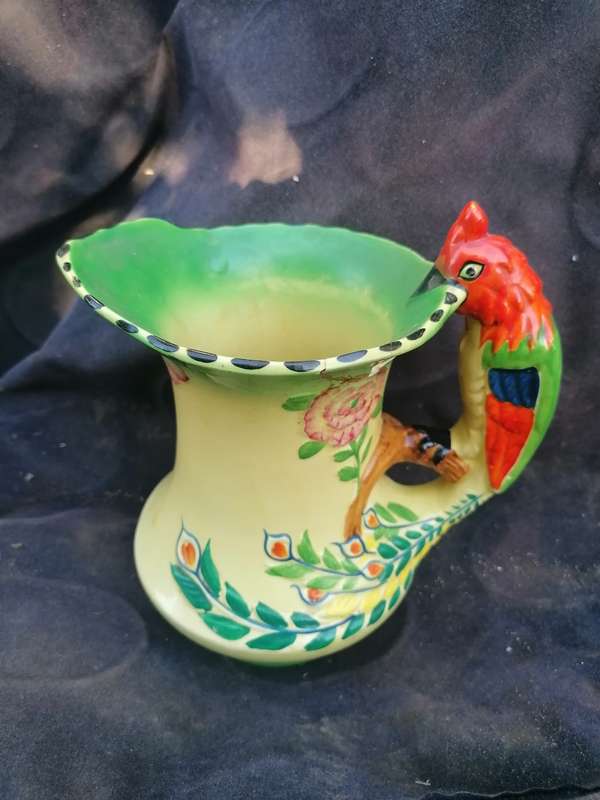 Vintage pitcher with repair