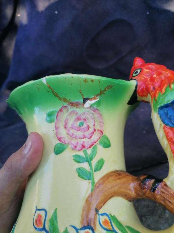 Vintage pitcher with repair