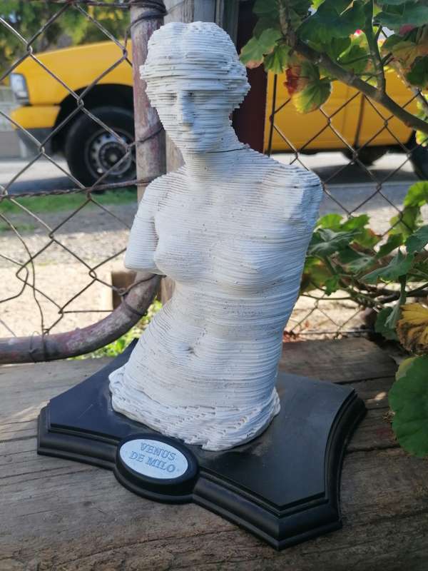 Small statue. Needs some glue at neck