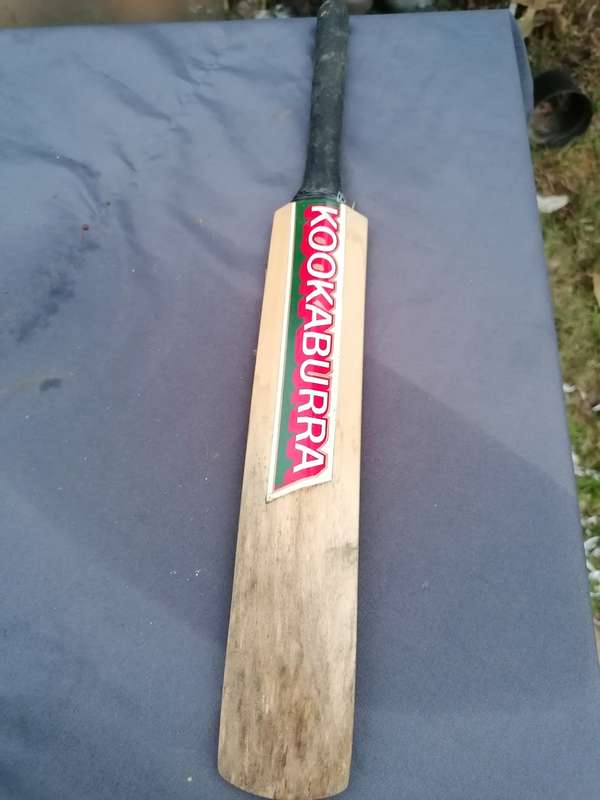 Minature cricket bat signed by Clive Rice and team
