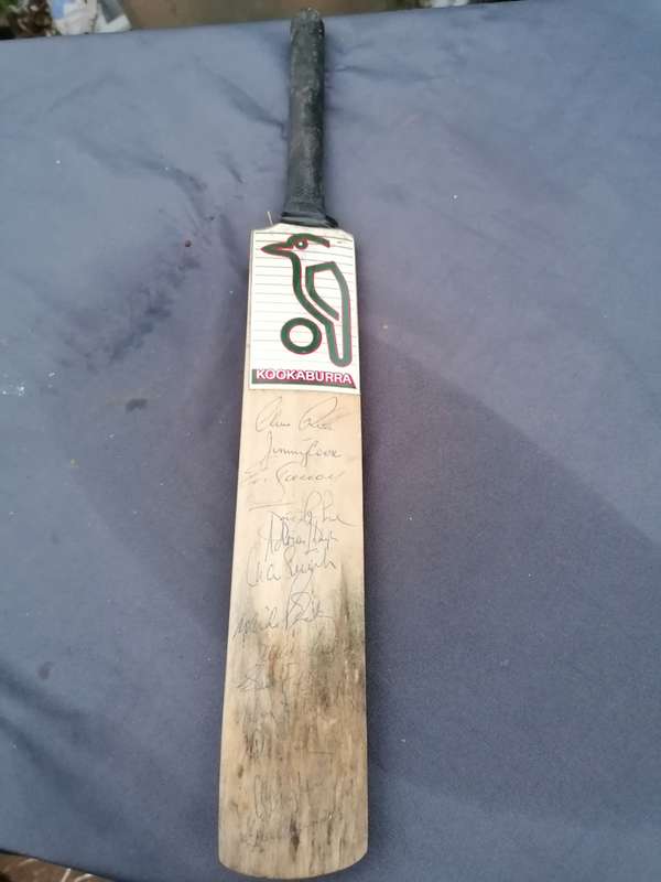 Minature cricket bat signed by Clive Rice and team