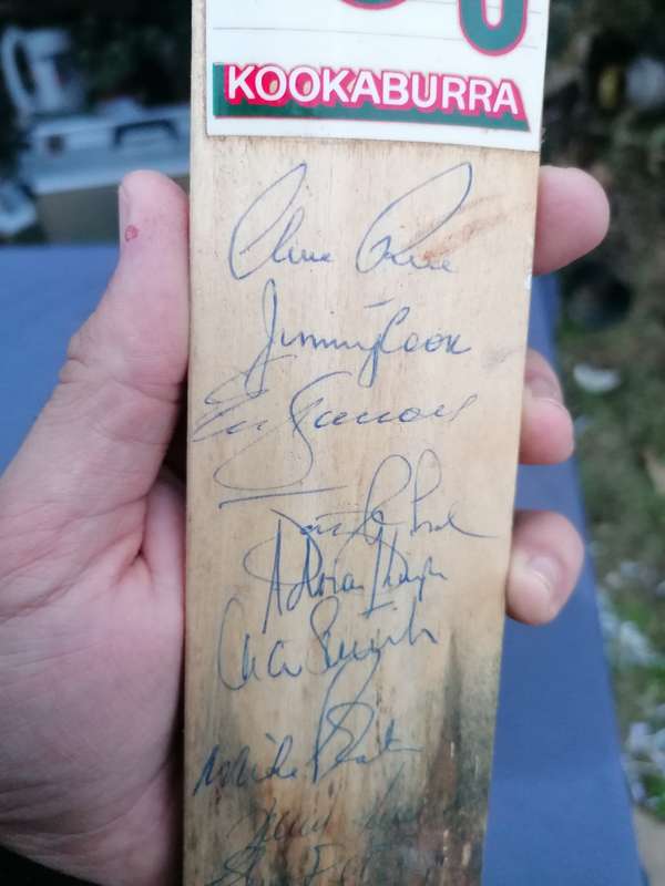 Minature cricket bat signed by Clive Rice and team
