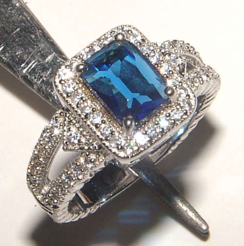 PURE PERFECTION! SOLID .925 STERLING SILVER RING WITH SAPPHIRE AND SIMULATED DIAMONDS!