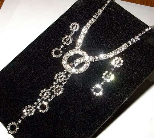 RHINESTONE ENCRUSTED SILVER NECKLACE AND EARRINGS SET