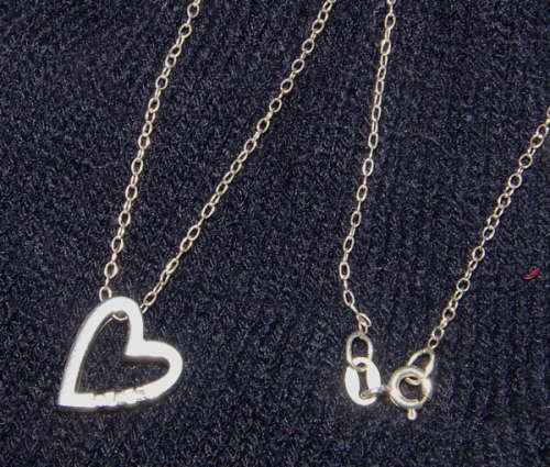 DESIGNER (SIGNED) DIAMOND PENDANT WITH .925 STERLING SILVER CHAIN
