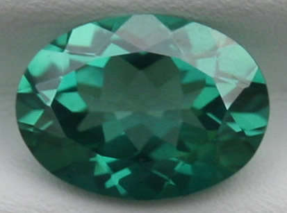NATURAL TOPAZ -  EMERALD GREEN OVAL CUT - 1.490cts