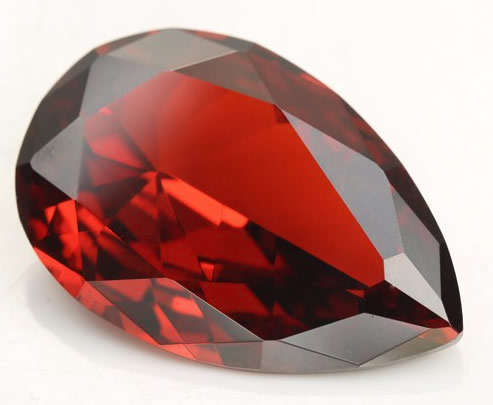NATURAL MOZAMBIQUE GARNET  -  ORANGE RED PEAR FACETED  - 0.530cts