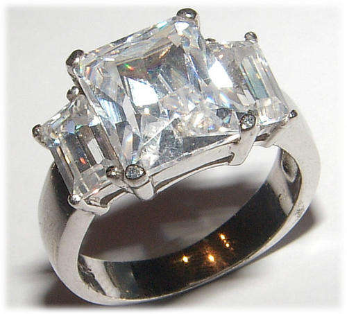 THREE STONE WHITE CZ STERLING SILVER  RING.