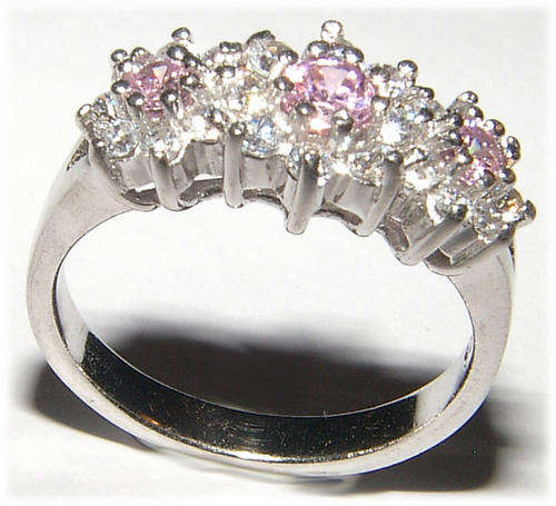WHITE CZ AND PINK SAPPHIRE STERLING SILVER RING.