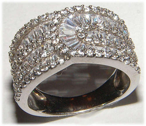 WHITE SIMULATED BAGUETTE DIAMOND STERLING SILVER DRESS RING.