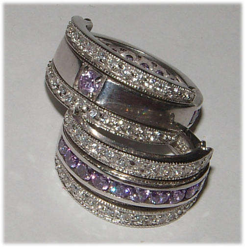 EXTRAORDINARY ITEM! - REVERSABLE LAVENDER CZ AND DIAMOND SIMULANT STERLING SILVER RING.