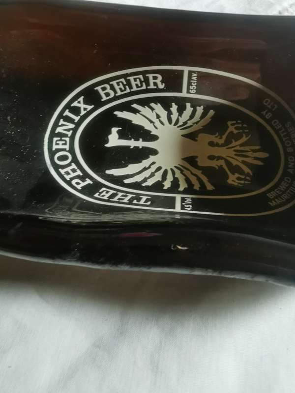 Unusual shaped glass beer bottle