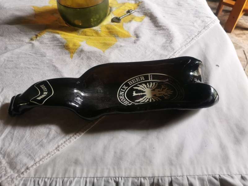 Unusual shaped glass beer bottle