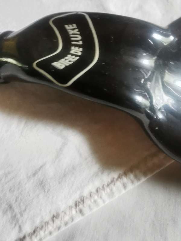 Unusual shaped glass beer bottle