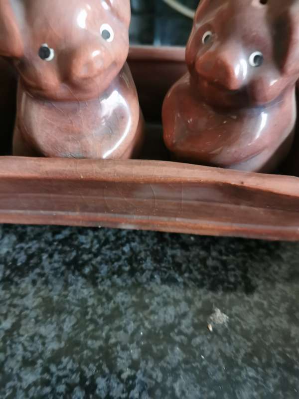 Vintage pig salt and pepper shakers in tray