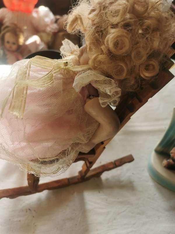 VINTAGE SMALL PORCELAIN DOLL ON ANTIQUE CHAIR
