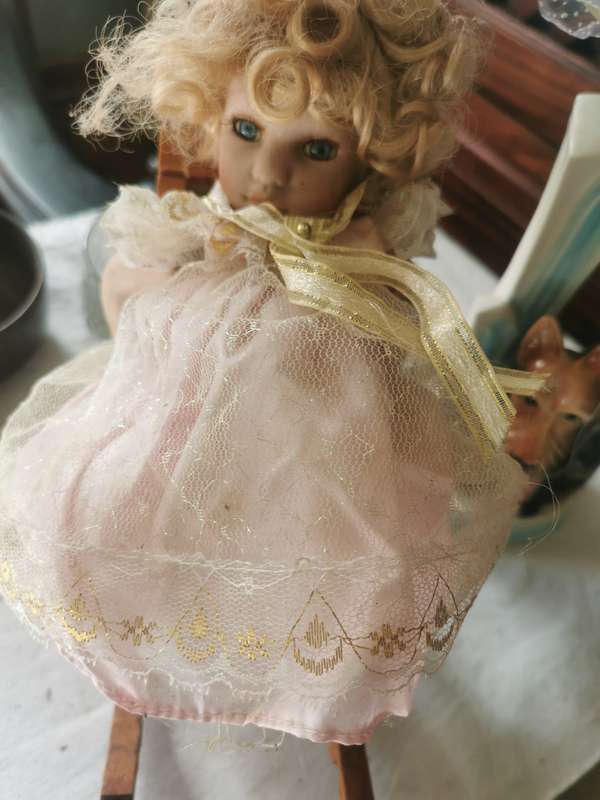 VINTAGE SMALL PORCELAIN DOLL ON ANTIQUE CHAIR