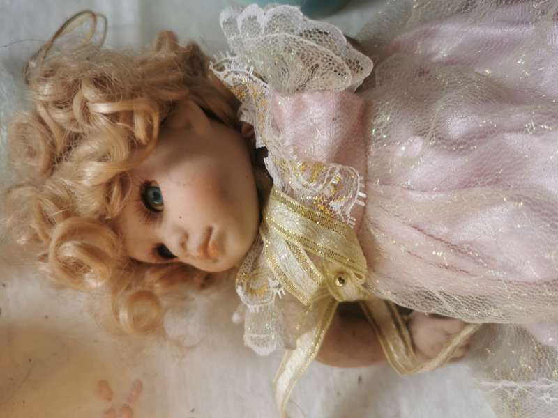 VINTAGE SMALL PORCELAIN DOLL ON ANTIQUE CHAIR