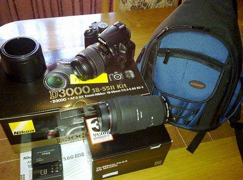 Nikon D3000 DSLR Body + Nikon 18-55mm Lens + Sigma 70-300mm Lens + Bag + Tripod + SD Card