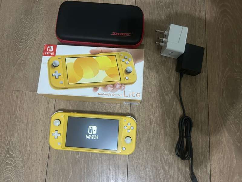 Nintendo Switch Lite (Yellow) with case  + Original UK Charger