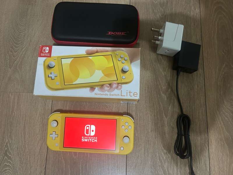Nintendo Switch Lite (Yellow) with case  + Original UK Charger