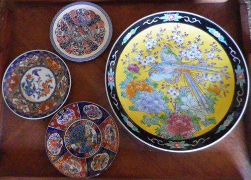 Four Imari Plates One 32cm across. Others smaller.